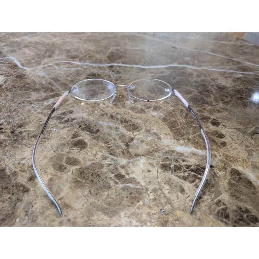Silhouette Eyeglasses 4476 40 6053 52[]17 135 5416 Titan Creme Rimless Austria